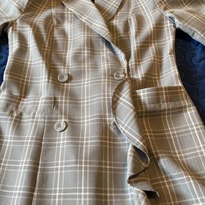 Gorgeous long jacket with ruffle in front.